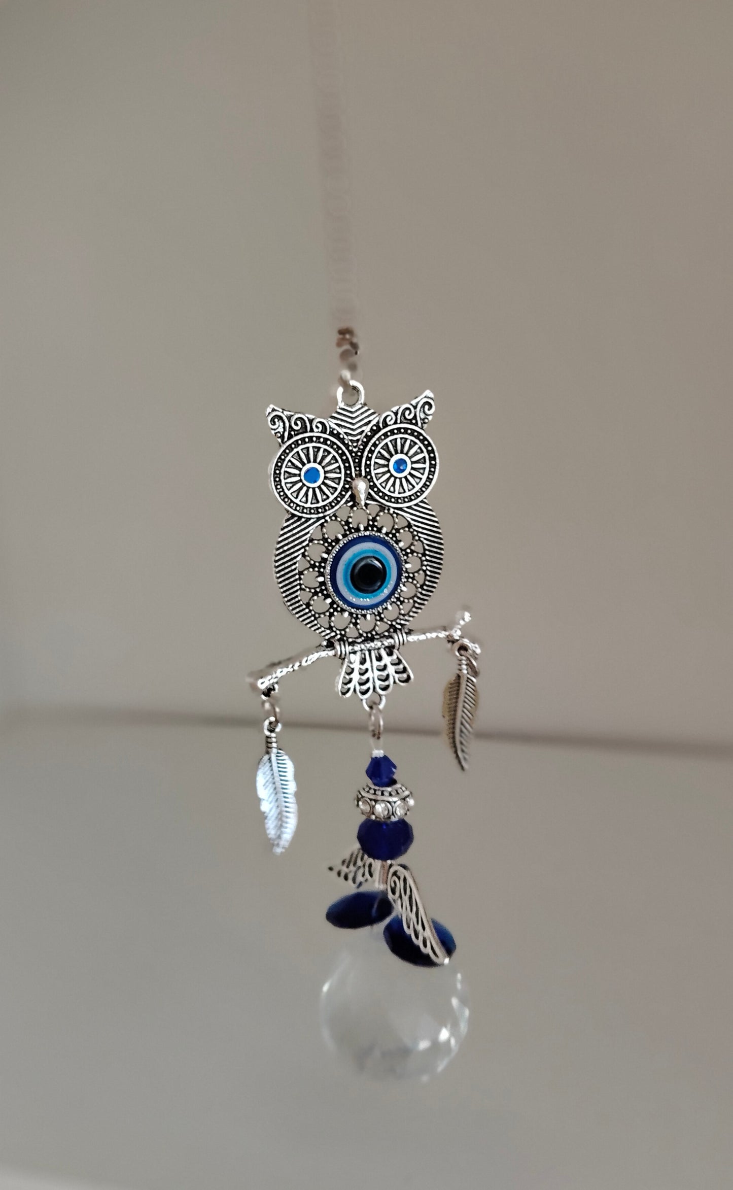 Suspension hibou mauvais œil avec prisme