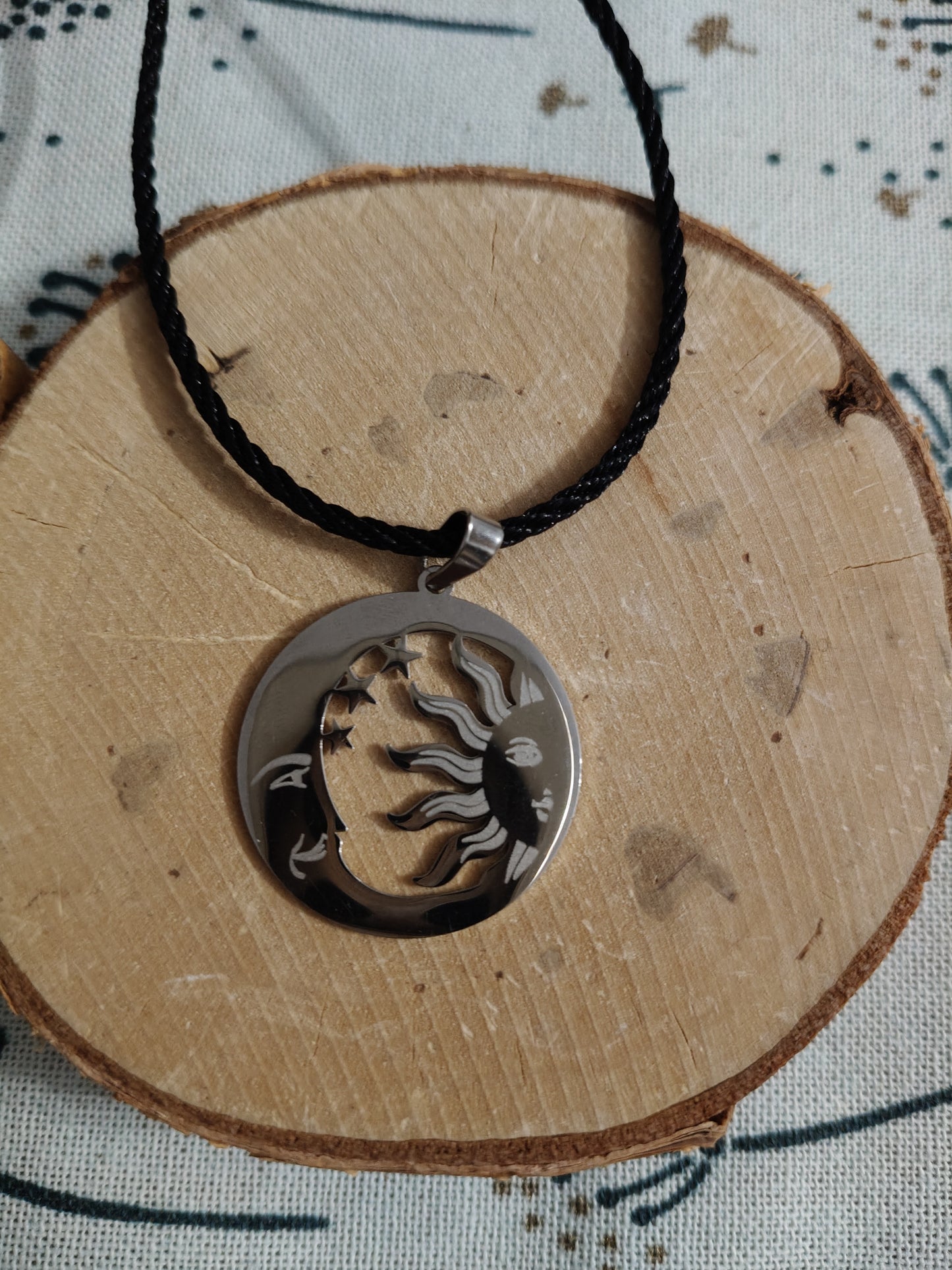 Sun and Moon pendant made of stainless steel and braided cord