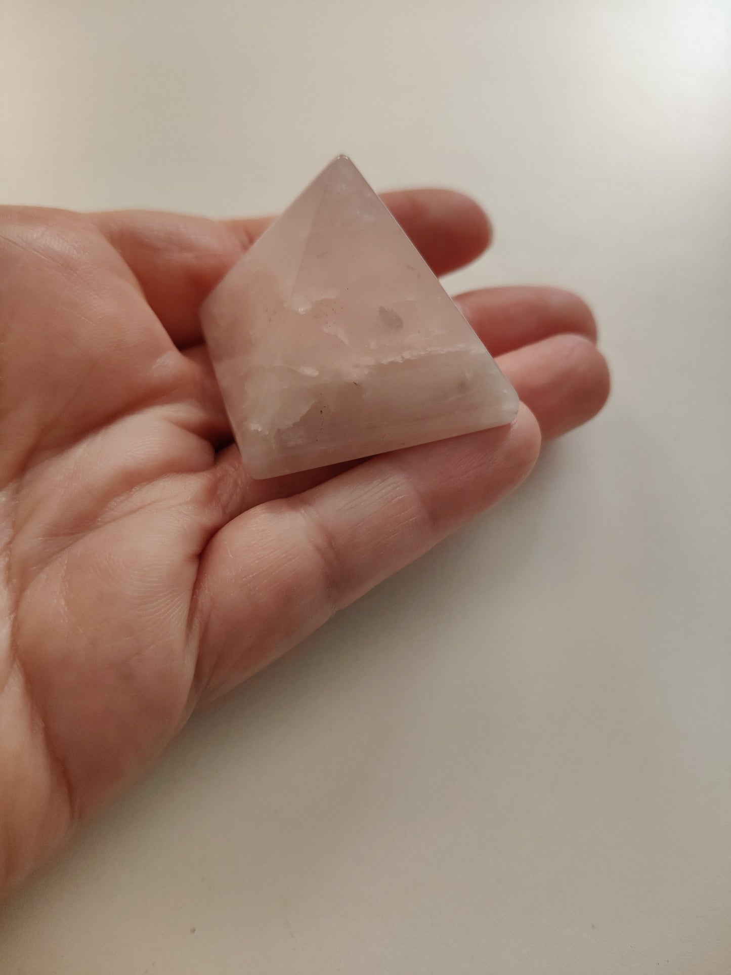 Rose Quartz Pyramid of approximately 55.5g and approximately 3.5x3.5cm.