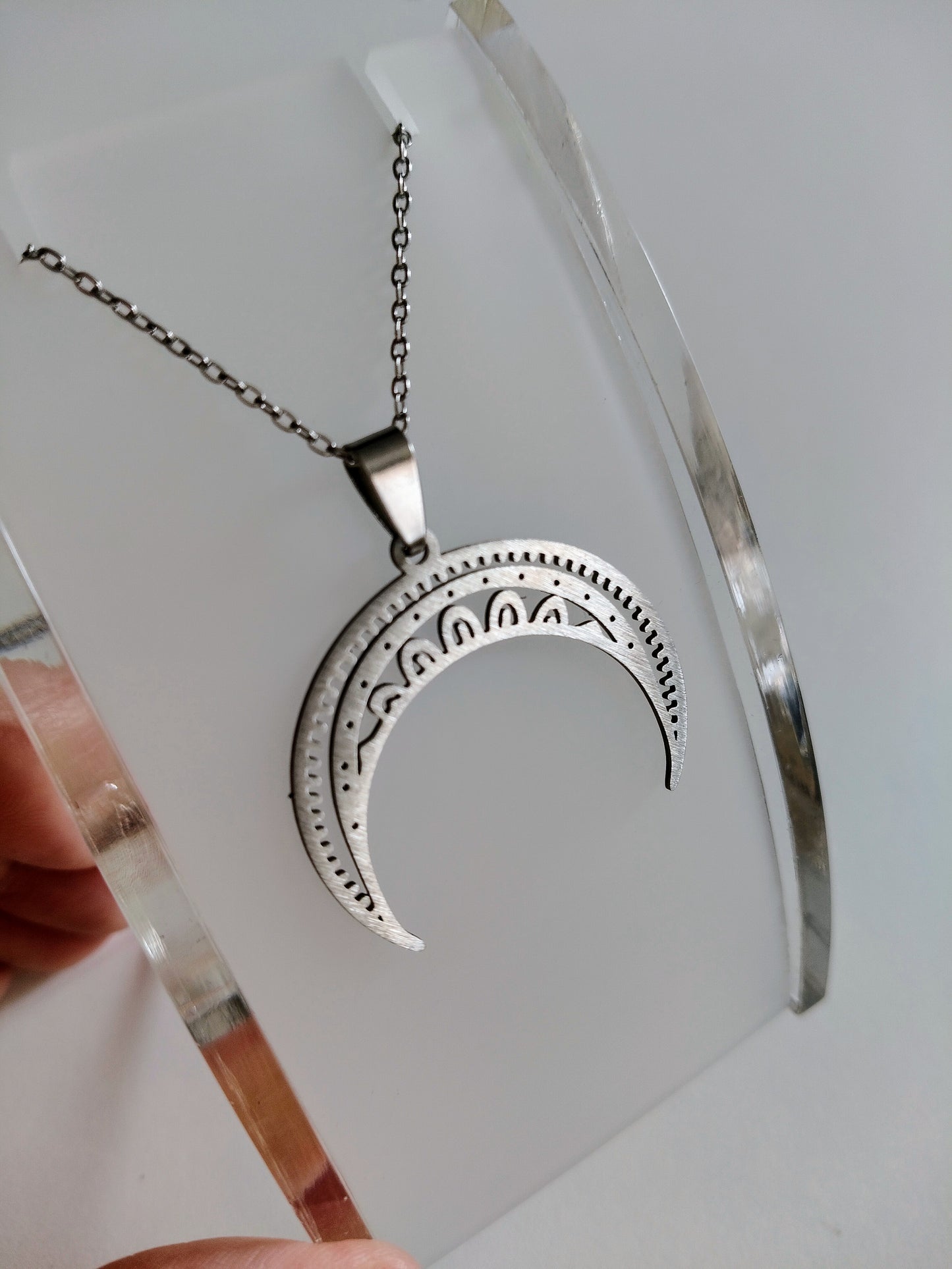 Inverted moon pendant in stainless steel