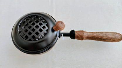 Quemador de hierro con mango