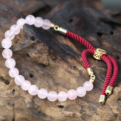 Pulsera de hilo burdeo con Cuarzo Rosa