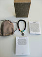 Pulsera de piedra lava con dije y piedras 7 chakras ( incluye caja , bolsita de terciopelo y cartulinas explicativas)